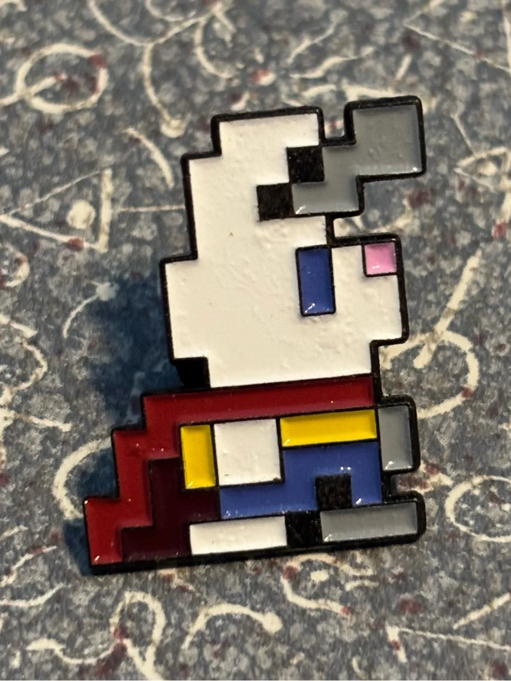 Tiny pixel bunny enamel pin collectible character from Bloxels